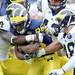 Michigan fullback Joe Kerridge carries the ball around linebacker Cameron Gordon  and linebacker Desmond Morgan during spring practice at Michigan Stadium on Saturday, April 13, 2013. Melanie Maxwell I AnnArbor.com